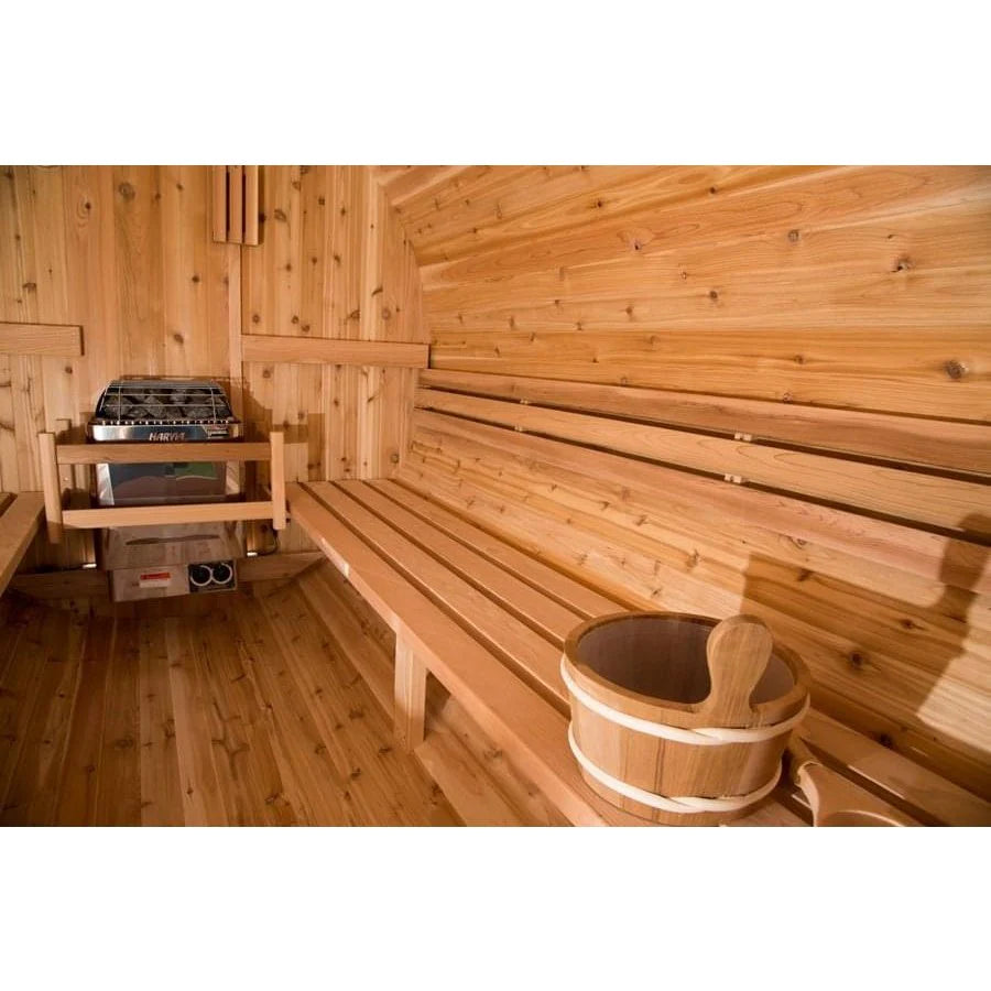 Roomy barrel sauna interior with curved cedar benches for social use.