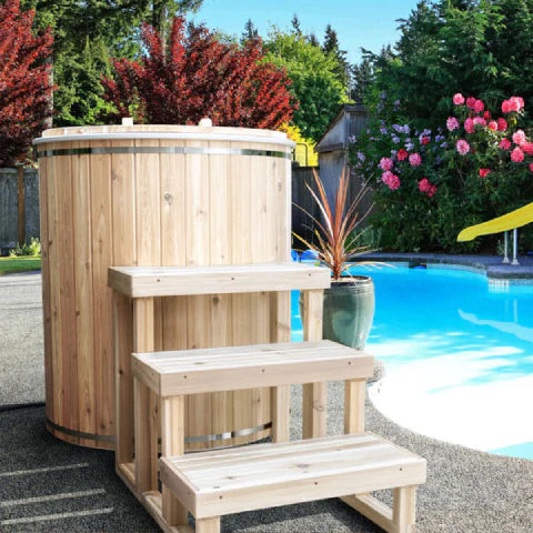 Compact cedar cold tub ideal for contrast therapy after sauna use.