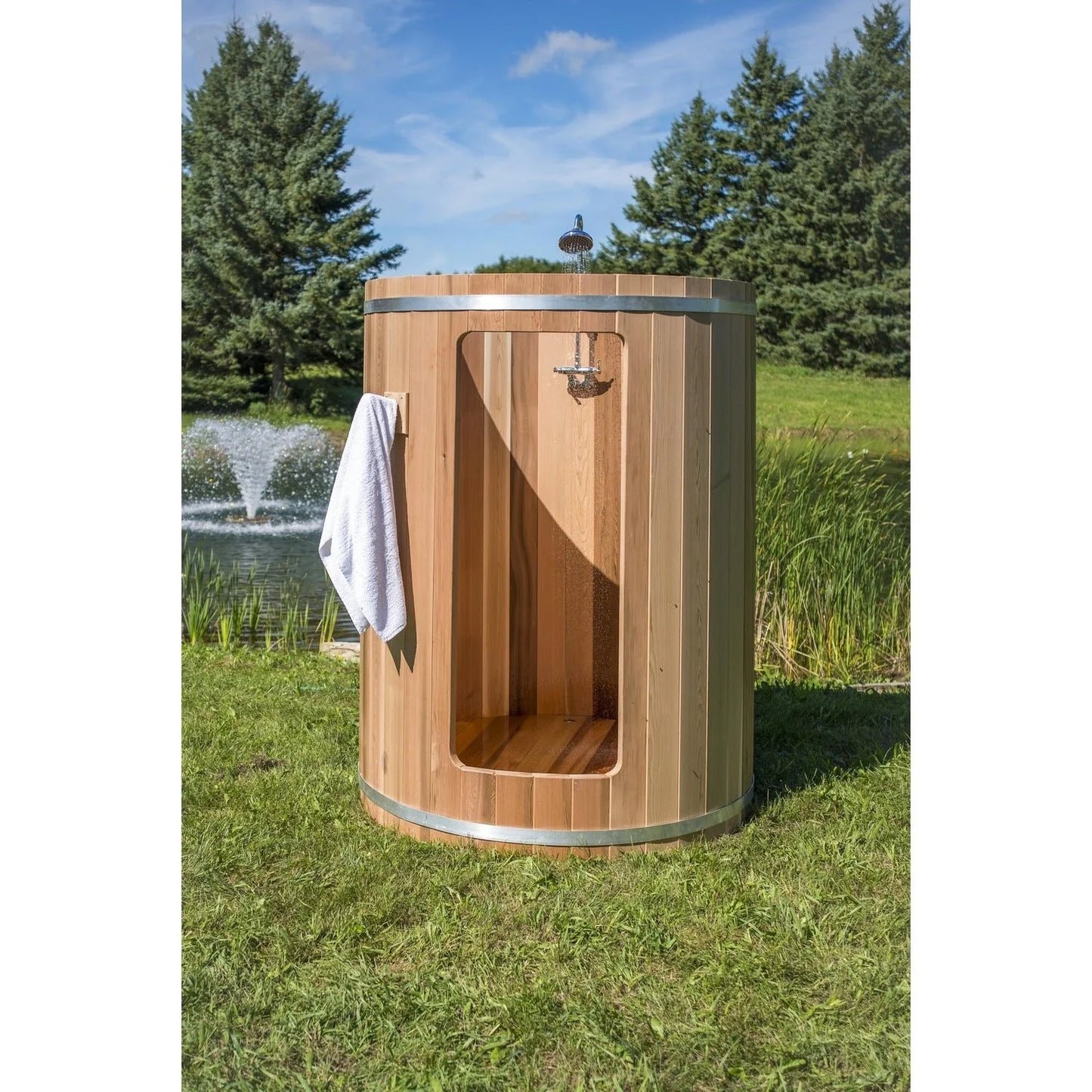 Cedar outdoor shower stall for use with saunas or pools.