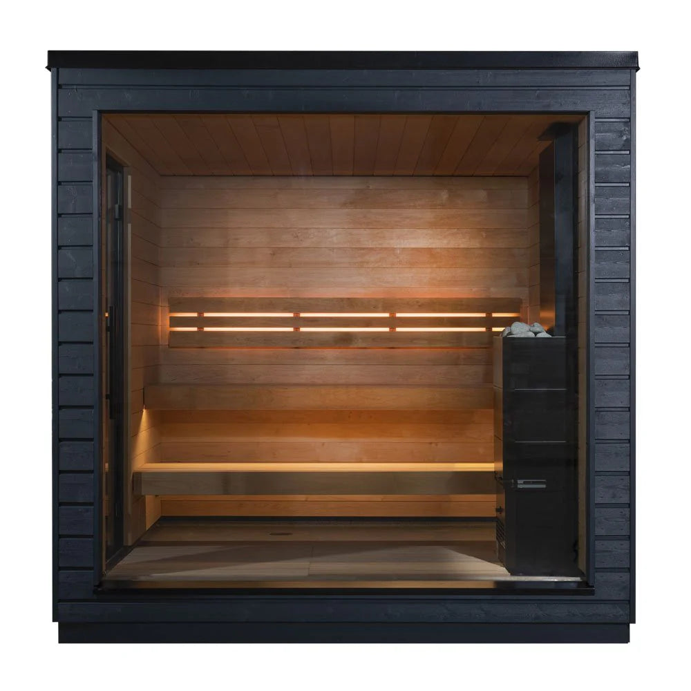 Spacious cedar cabin sauna with traditional sauna layout.