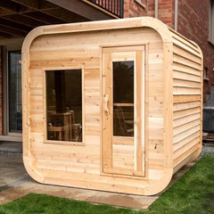 Dundalk Luna Cube modern outdoor cedar sauna for 2–4 people.