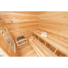 Contemporary cube sauna interior with warm cedar wood seating.